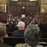 Orchestra & choir performing2